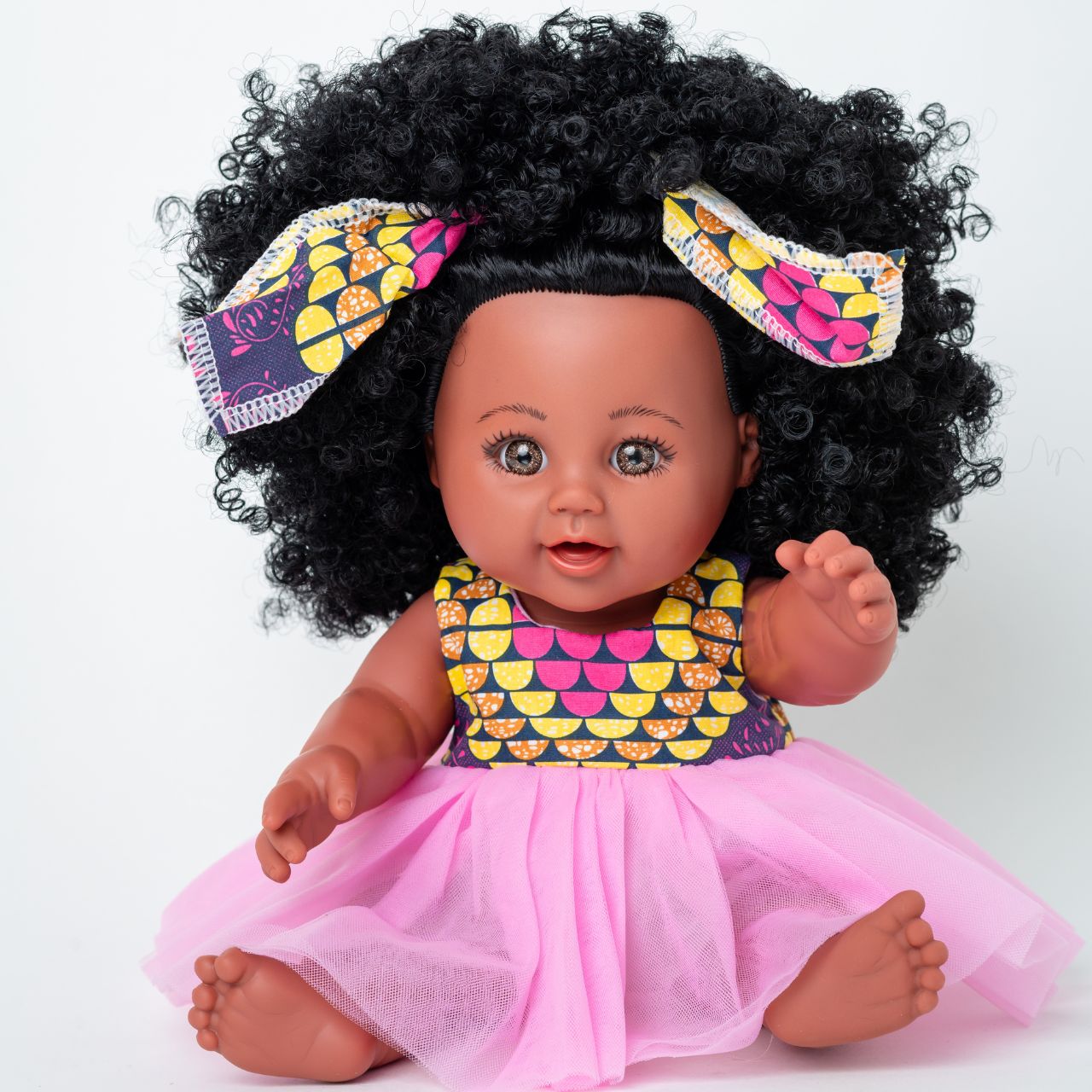 The Aimee Doll in Pink seated The Aimee Doll in Pink seated