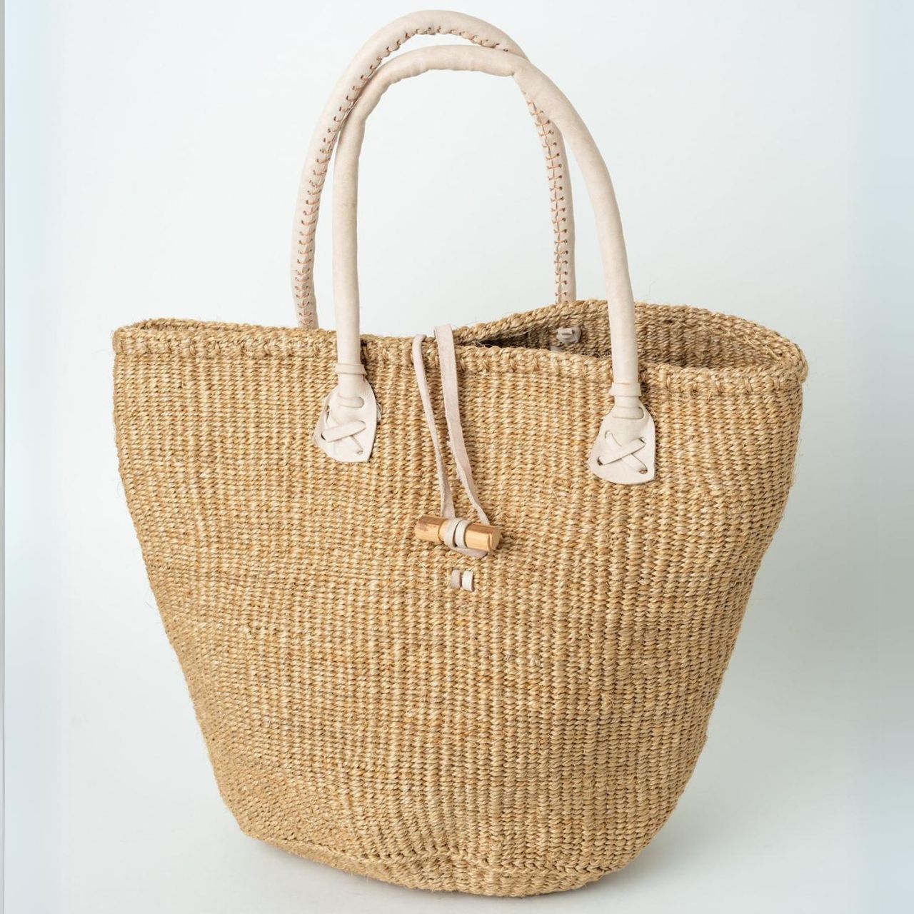 Light Brown Sisal Basket Bag with leather handles side Light Brown Sisal Basket Bag with leather handles side