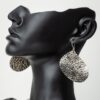 Handmade and hand-hammered silver earrings crafted in Kenya curved