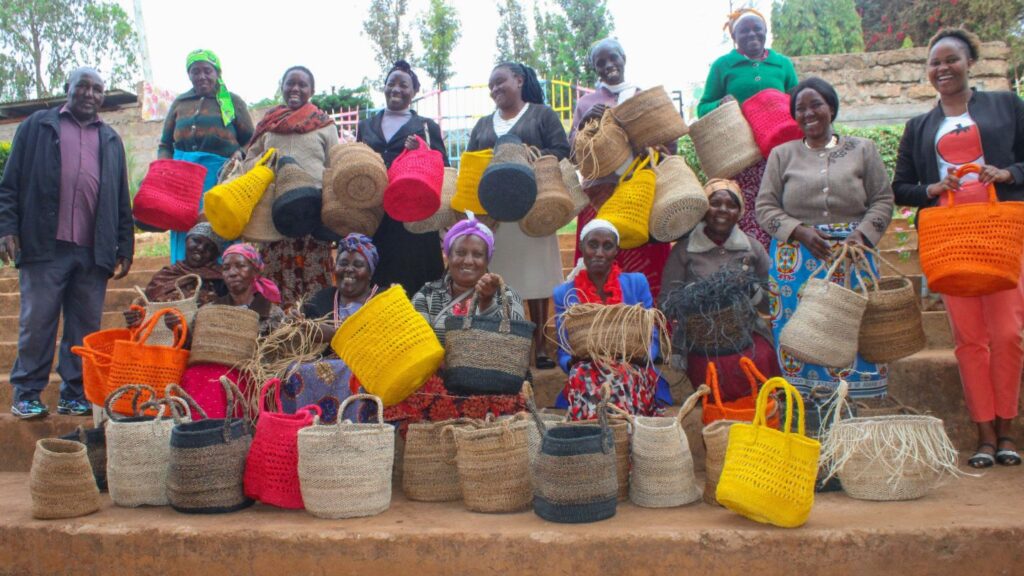 Jitegemee Children's Program. Members of staff with some of the back makers.
