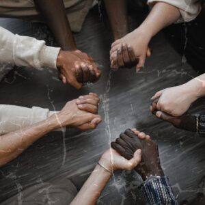 People holding hands - Ubuntu - I am because we are.