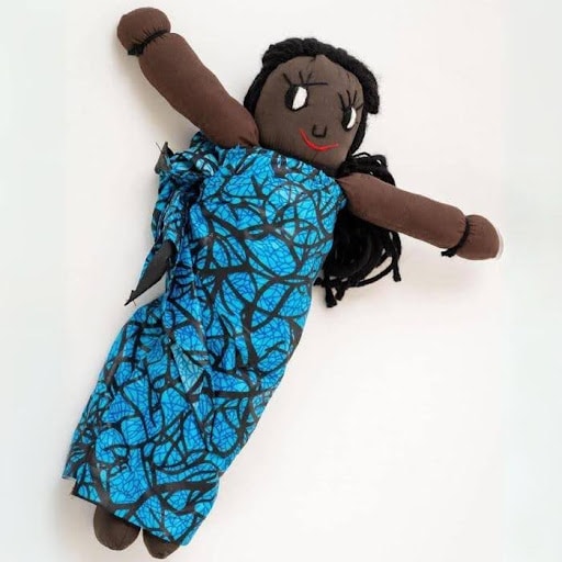 Handmade cloth doll in blue dress