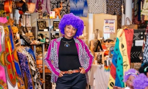 Positively Africana By Aimee founder in the shop with handmade African gifts